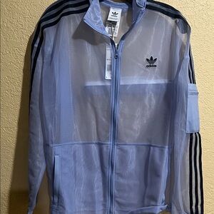 💙💙 SOLD SOLD SOLD 💙💙
Adidas Light Blue Sheer Track Jacket with Black Stripes-